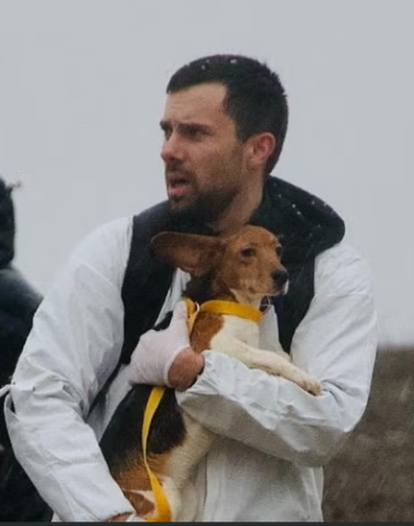 Individuals carry dogs out of Ridglan Farms on March 15, 2026. The Dane County Sheriff’s Office has referred charges to the local district attorney against 62 people involved in the March 15 incident. Source: Coalition to Save the Ridglan Dogs