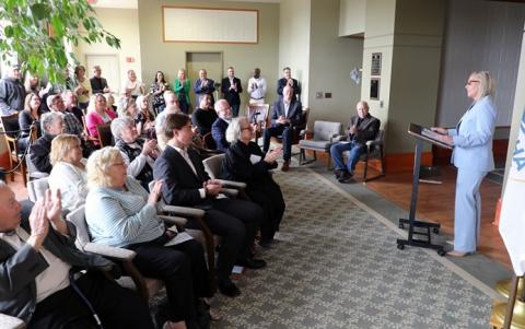 Kenosha County Executive Samantha Kerkman speaks before a small crowd in the county Administration Building. 