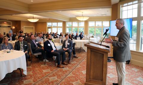 Consultant Erik Doersching is shown addressed an audience at Strawberry Creek. 