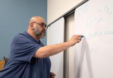 Bobby Ayala starts a participatory defense meeting Monday, Feb. 2, 2026, at the Racine Public Library in Racine, Wis. Angela Major/WPR