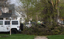 Debris from a severe storm covers a sidewalk Saturday, April 18, 2026, in Janesville, Wis. Angela Major/WPR