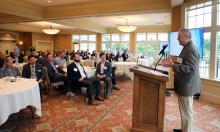 Consultant Erik Doersching is shown addressed an audience at Strawberry Creek. 