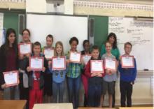 Students pose with their newly earned "EverFi" Financial Training Certificates after completing training offered by Educators Credit Union